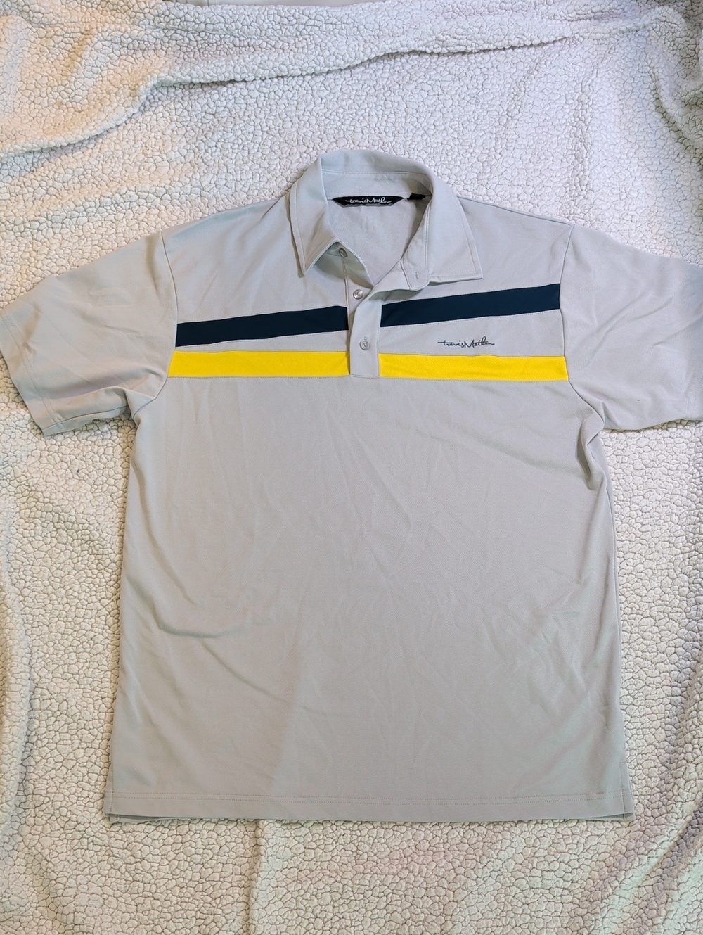 Travis Mathew Light Gray Polo with Navy & Yellow Chest Stripes